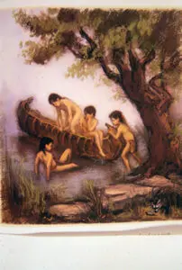 Four children in a canoe by a tree.